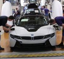 BMW ratchets up cuts as operating profit falls