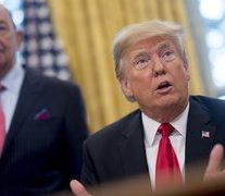 Trump threatens tariffs on cars from Mexico, stays optimistic on China deal