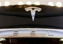Tesla closes on $2.7 billion mixed offering of shares, debt